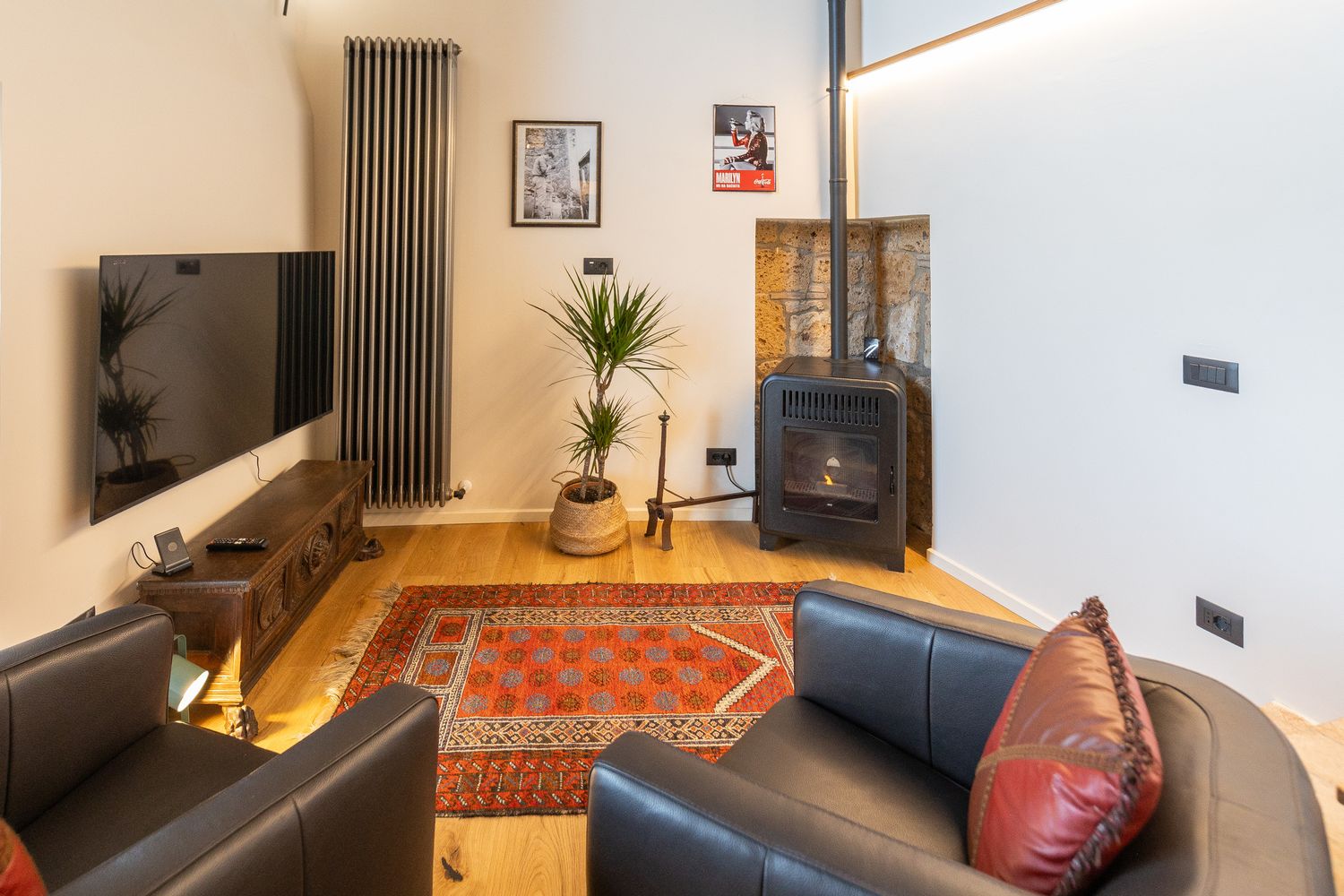Seating area with television and stove