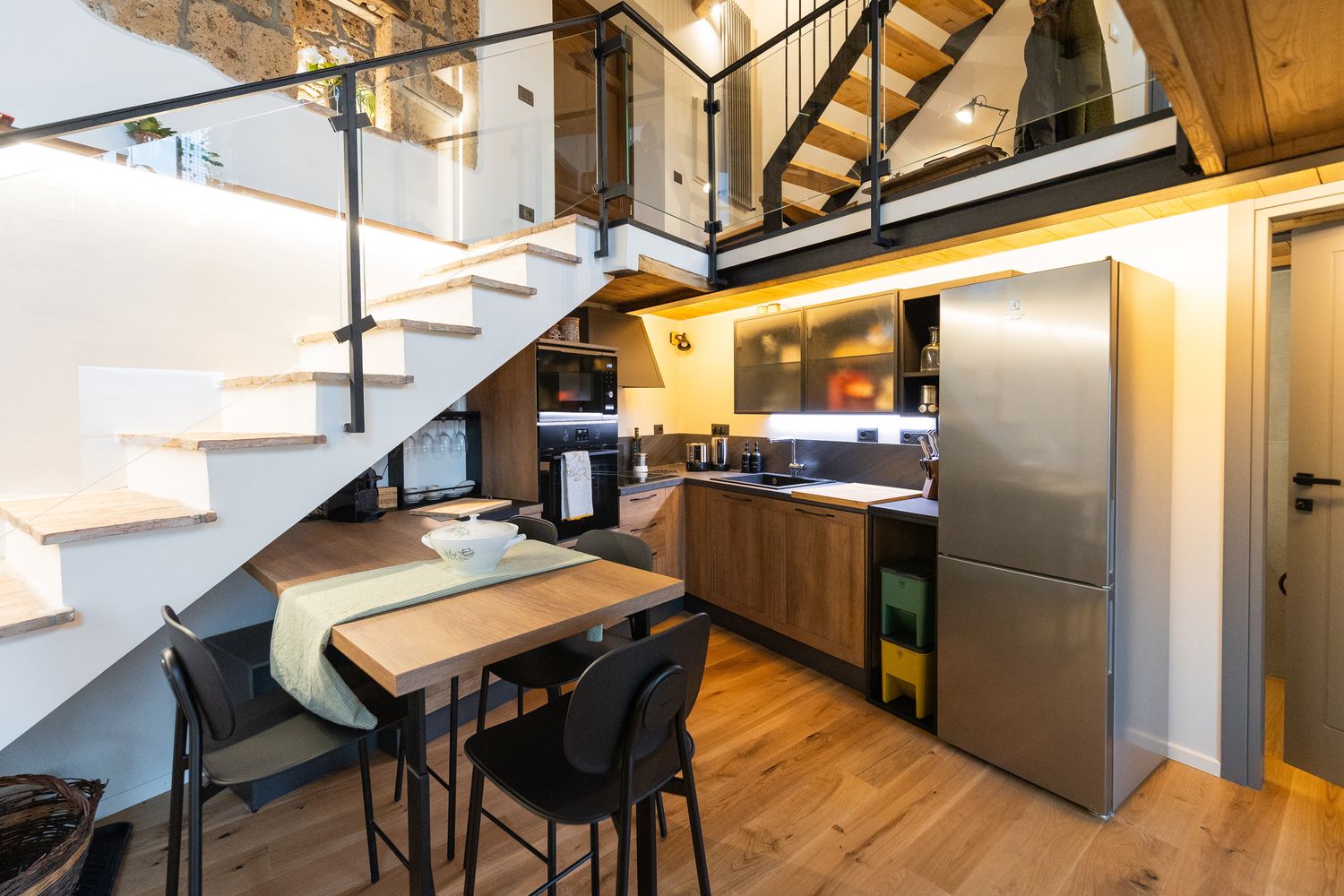 Kitchen and dining space below the mezzanine